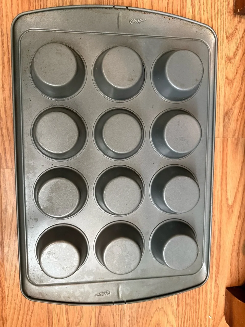 Wilton 12-cup muffin pan featuring a durable steel construction , nonstick